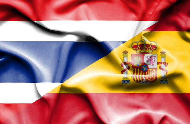 挥舞着西班牙和泰国的旗帜图片下载