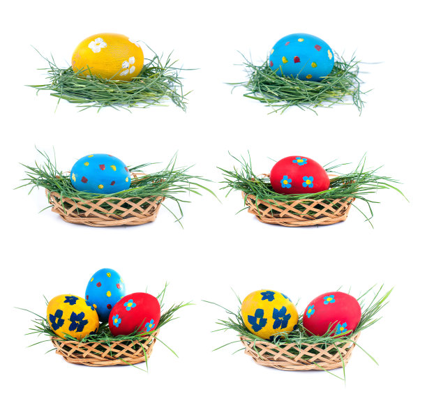 三个复活节彩蛋在一个篮子在白色的背景，收集图片下载