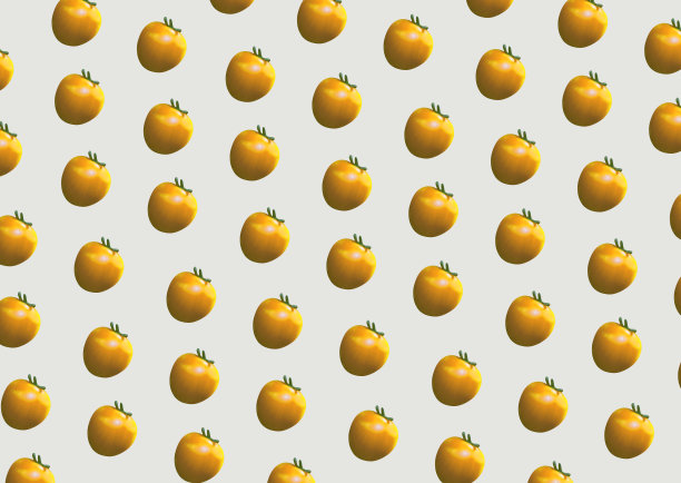 黄色的小番茄以有趣的图案排列在朴素的背景上图片下载