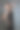 年轻的黑发女士在黑色裙子摆姿势在深灰色的背景。工作室拍摄，垂直图像图片图片下载