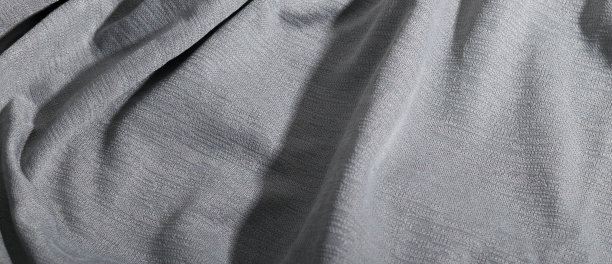 抽象典雅的浅灰色面料，灰色纺织背景。图片下载