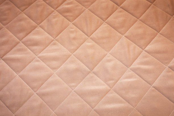 绗缝毯子柔软的粉红色背景图片下载