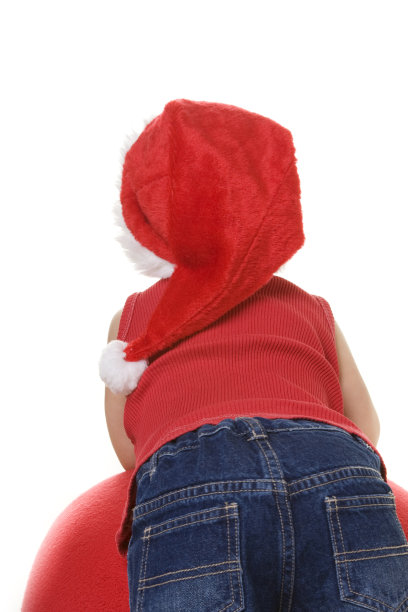 戴着圣诞帽的小孩的后背图片下载