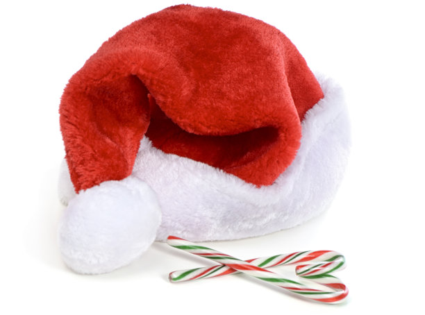 圣诞老人的帽子和糖果手杖在白色的背景图片下载