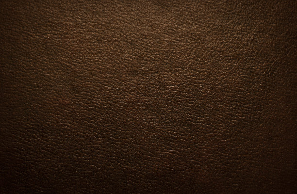 一个纹理棕色皮革织物的特写照片图片下载