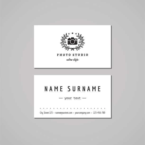 照相馆名片设计理念。相机和花环图片下载
