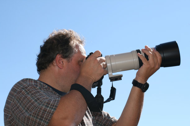 一个大镜头的摄影师图片下载