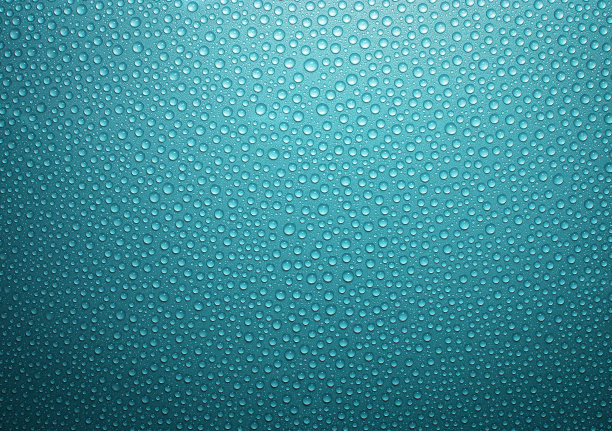 水滴落在绿松石般的金属表面图片下载