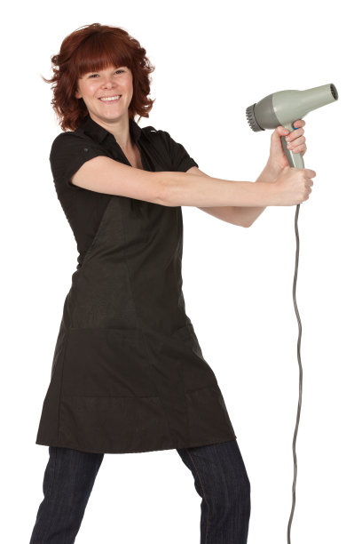 拿着吹风机的女人图片下载