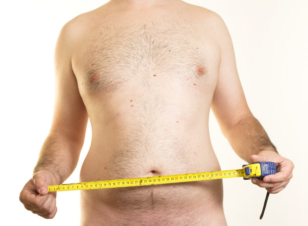 男性躯干和卷尺图片下载