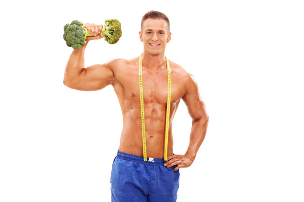 英俊的年轻运动员拿着一个花椰菜哑铃图片下载
