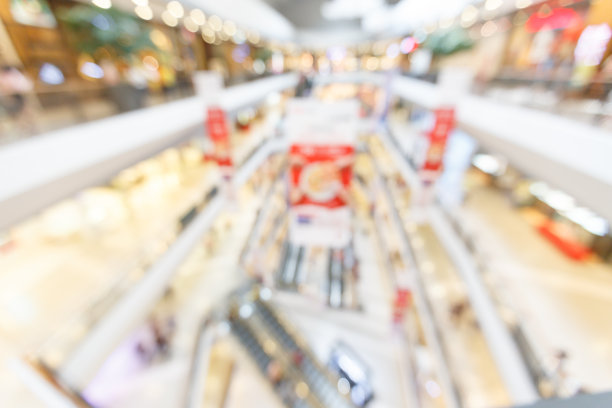 抽象模糊曼尼人们在百货商店购物。商业图片下载