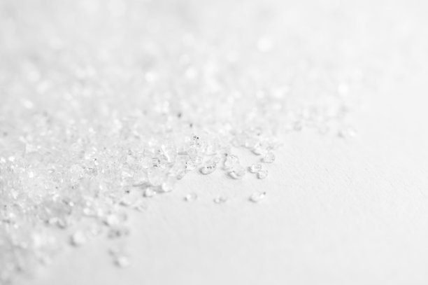 白糖晶体的近景是模糊的背景图片下载