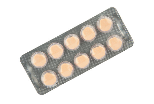 泡罩包装的橙色药片图片下载