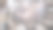 年轻的多种族夫妇穿着睡衣躺在床上看照片。男人和女人都在使用智能手机。视图通过窗帘图片下载