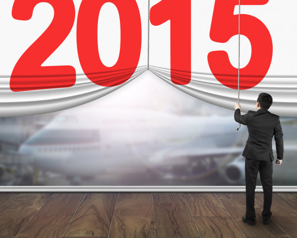 商人拉开2015年的帘子，展示飞机的阳光图片下载