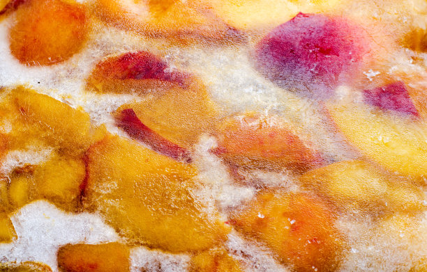 冰冻冰冻桃子与水果切片，作为背景图片下载