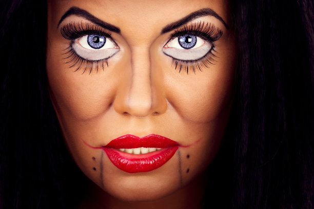 有创意的妆容和睫毛的女人的脸图片下载