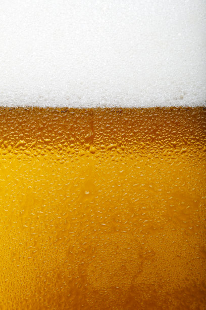 特写照片的啤酒与泡沫和泡沫图片下载
