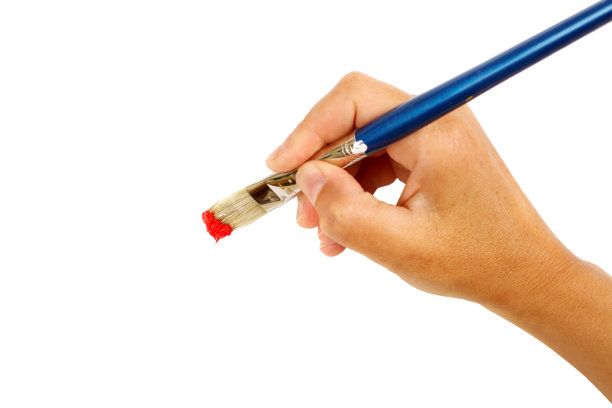 手和刷子与红色油漆图片下载