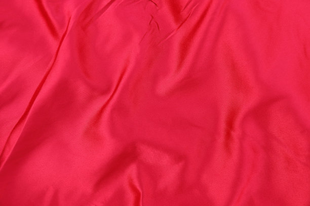 优雅的弯曲红色丝绸质地的背景和设计图片下载