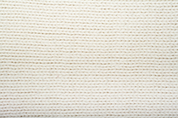 白色针织物纹理的图案。羊毛的背景图片下载