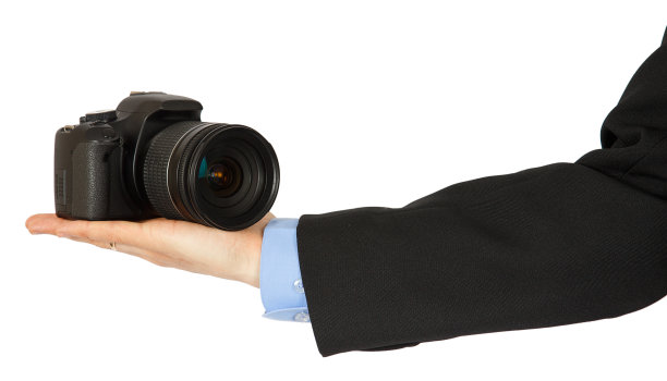 一个男人手上的黑色照相机图片下载