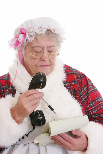 圣诞:圣诞老人带着笔记本和电话图片下载