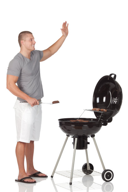 一个人在烧烤，挥舞着他的手图片下载