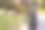 前视图的年长妇女骑车通过公园素材图片