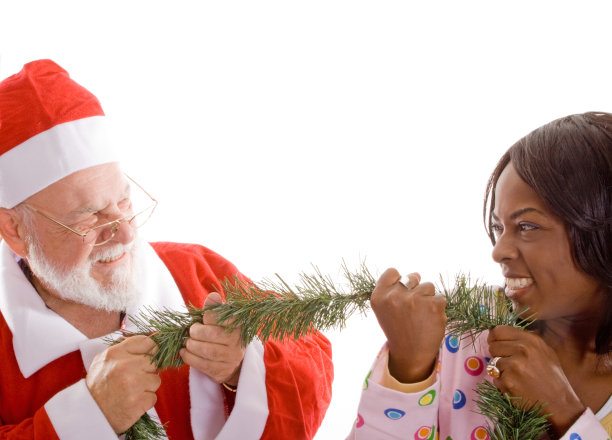 圣诞老人玩拔河年轻女子圣诞花环孤立图片下载