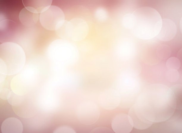 柔和的粉黄色粉彩抽象模糊的背景。素材图片