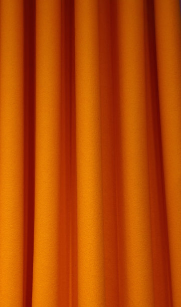 沉重的橙色毛毡纺织品窗帘折叠背景图片下载