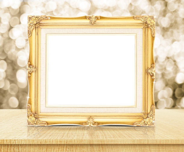 空白金色复古相框与闪闪发光的黄金散景墙图片下载