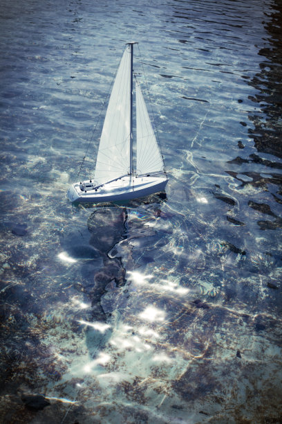 在池塘里航行的玩具船图片下载