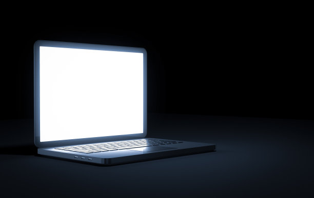 黑色背景下的笔记本电脑图片下载