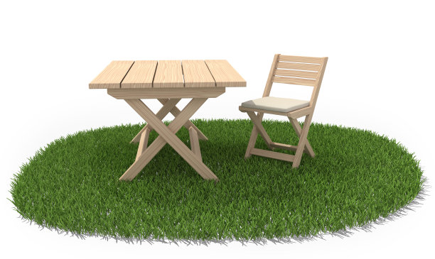 在绿色草地上折叠桌椅图片下载