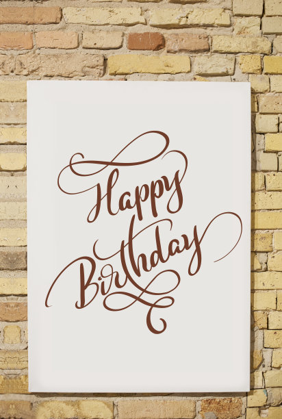 砖墙和白色的纸和文字生日快乐。书法字体图片下载
