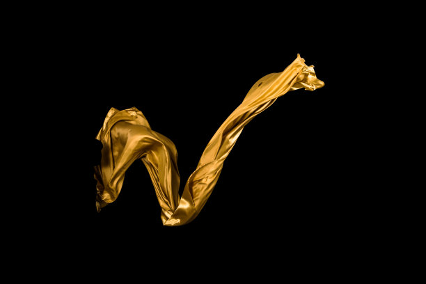 金色柔软的缎子在风中飞舞的背景图片下载