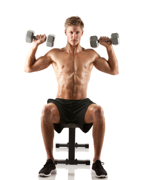 肌肉发达的男人用哑铃锻炼图片下载