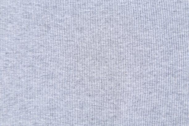 浅灰色针织面料纹理背景。图片下载