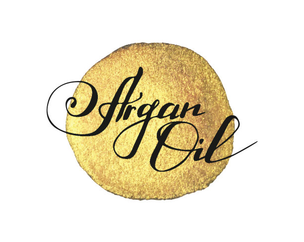 手写文字摩洛哥坚果油上金色油漆溅上白色图片下载