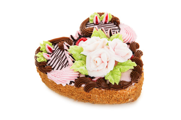 心形巧克力蛋糕，上面点缀着奶油花图片下载