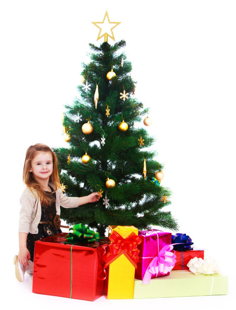 小女孩在圣诞树下图片下载