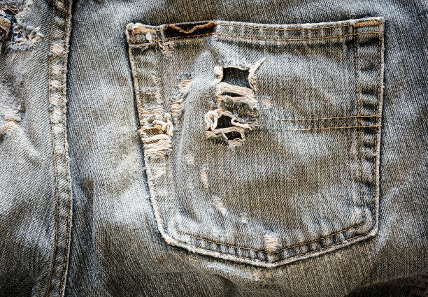 破旧的蓝色牛仔裤口袋。图片下载