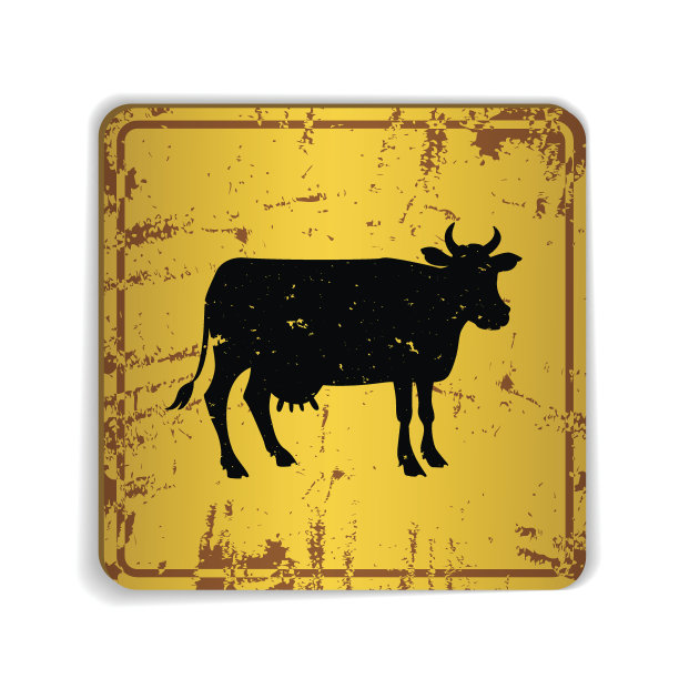 带有奶牛剪影的黄色旧路标图片下载