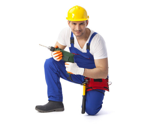 微笑的勤杂工拿着钻机图片下载