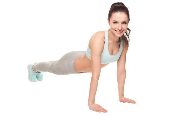 运动女子俯卧撑在白色的背景。健身模式图片下载