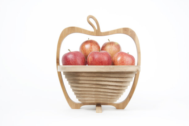 苹果形状的木水果碗与红苹果图片下载