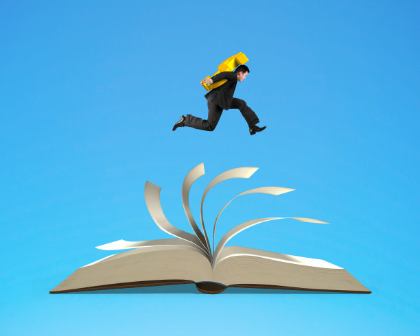 商人携带美元符号和运行在打开的书图片下载